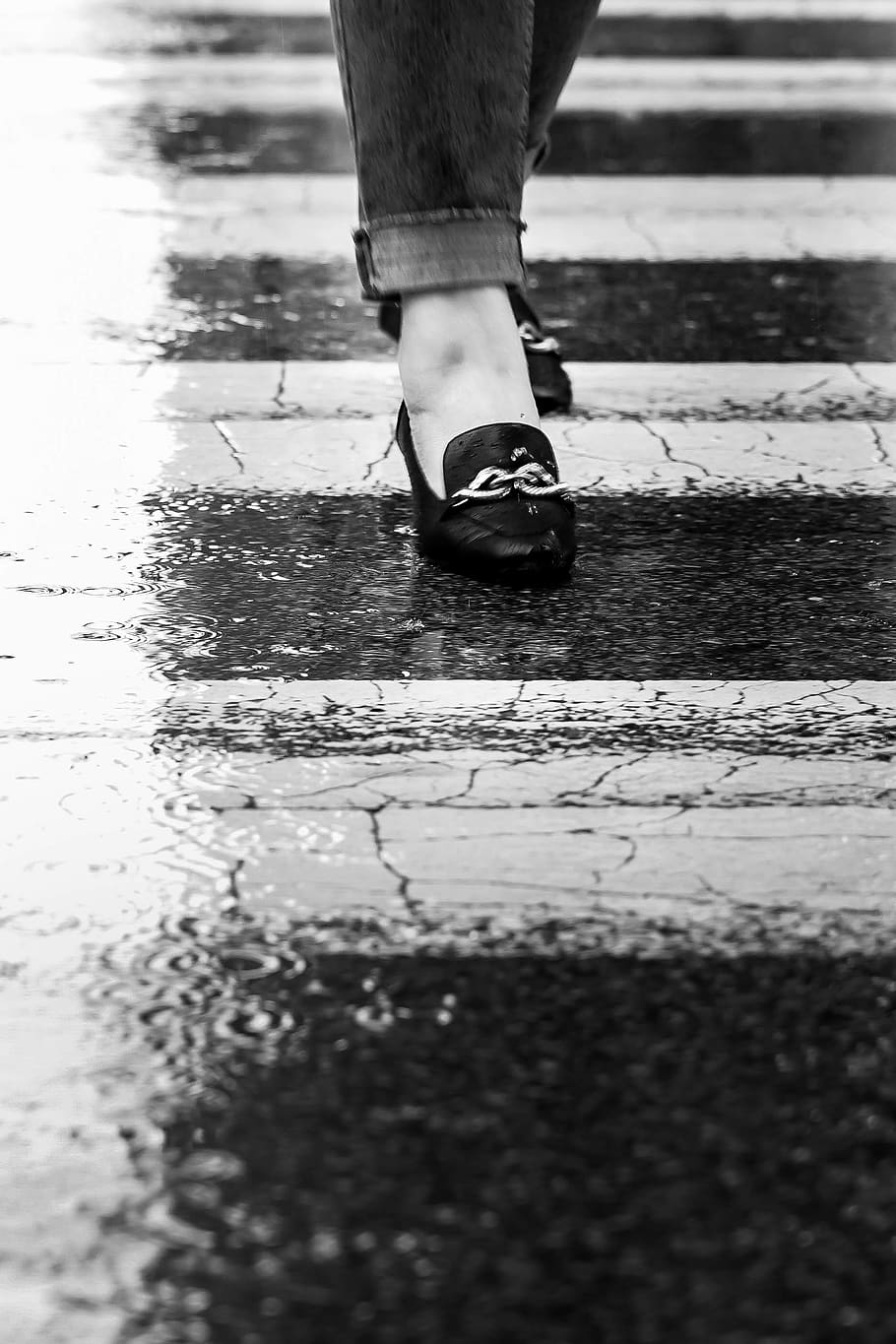 grayscale photography of woman's feet wearing horsebit loafers while walking along pedestrian lane, HD wallpaper