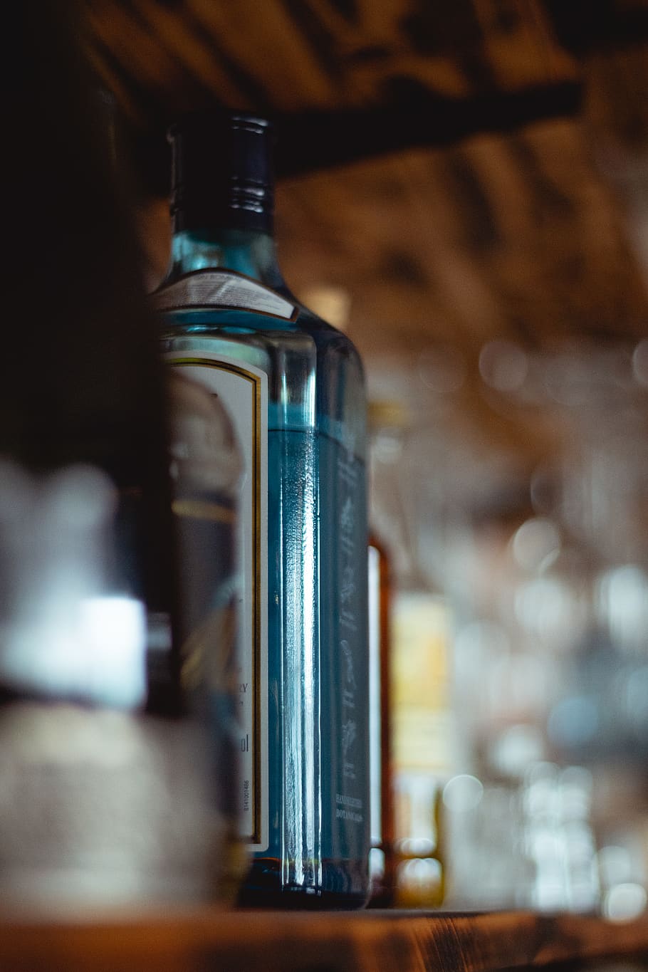 Clear Glass Bottle On Shelf, alcohol, bar, beverage, container HD wallpaper