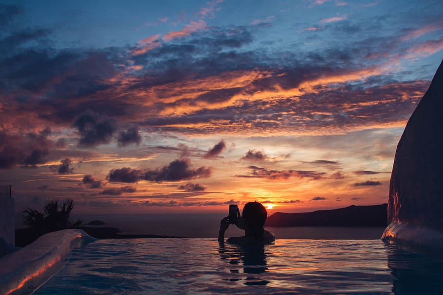 greece, santorini, sunset, water, sky, cloud - sky, two people HD wallpaper