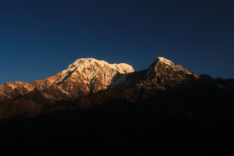 snow capped mountain under blue sky, mardi himal trek, nepal
