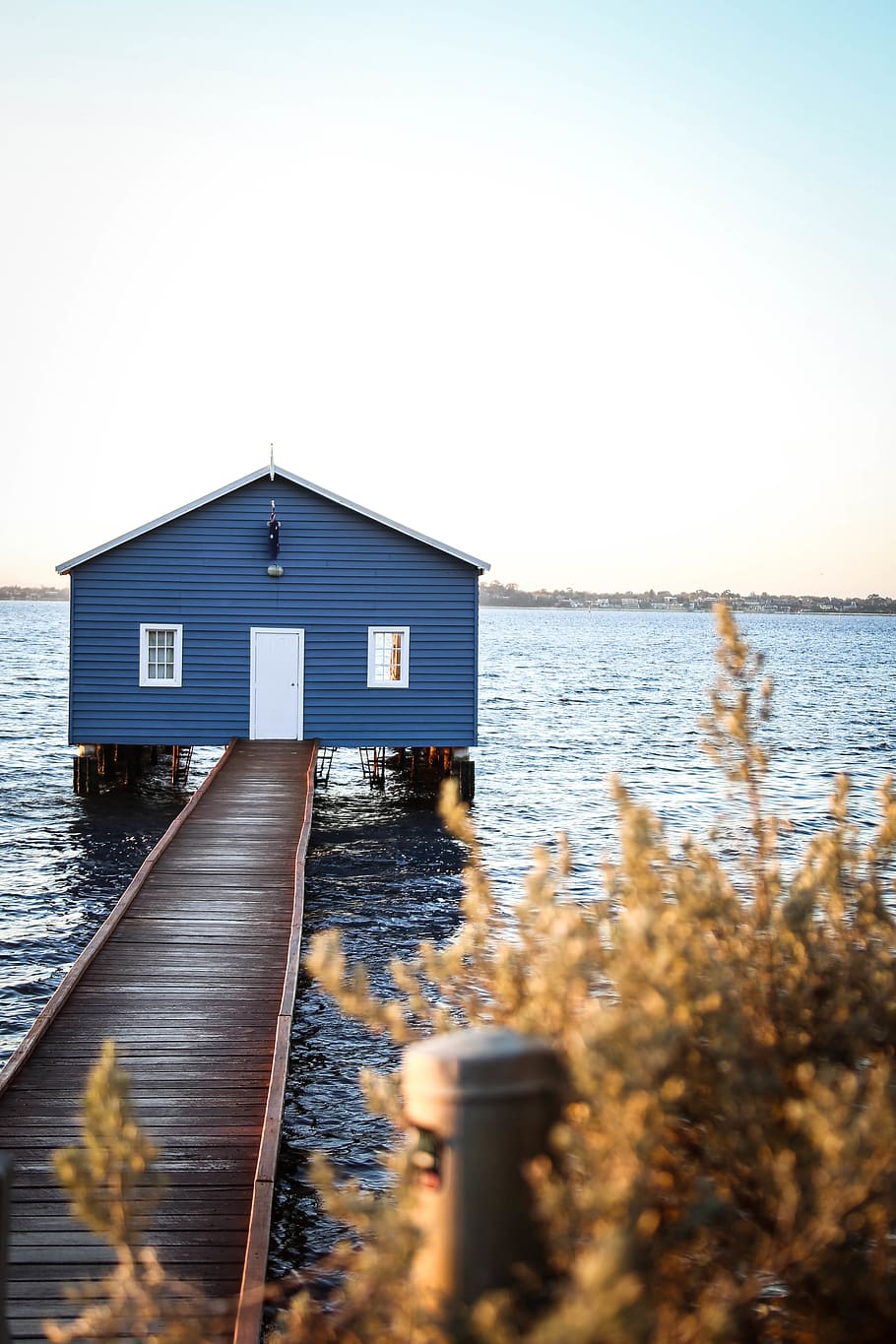 House With Dock on Body of Water Under Blue and White Sky, architecture HD wallpaper