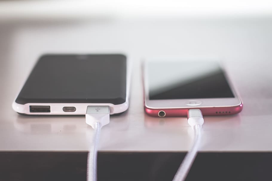 Closed Up Photography of Two Iphones, apple, black, braided, cable HD wallpaper