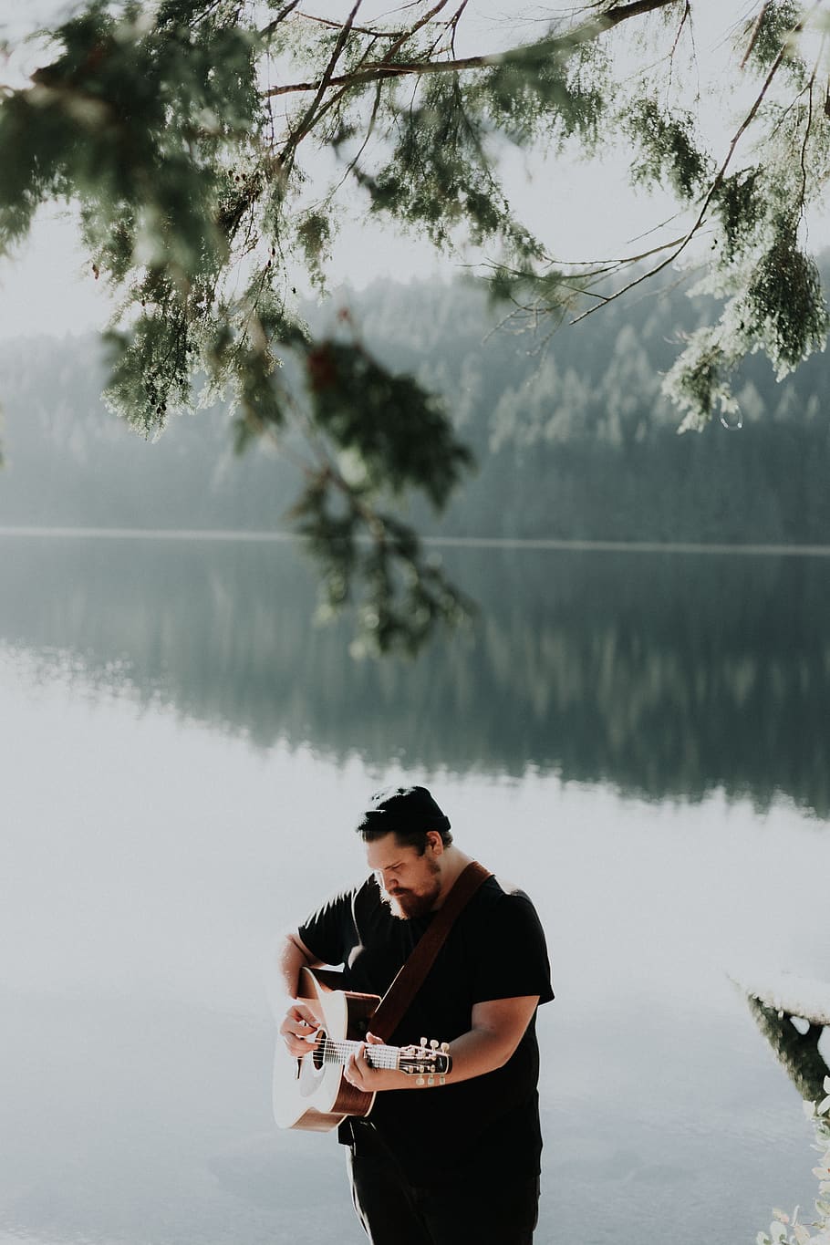 man playing brown acoustic guitar near body of water, one person, HD wallpaper