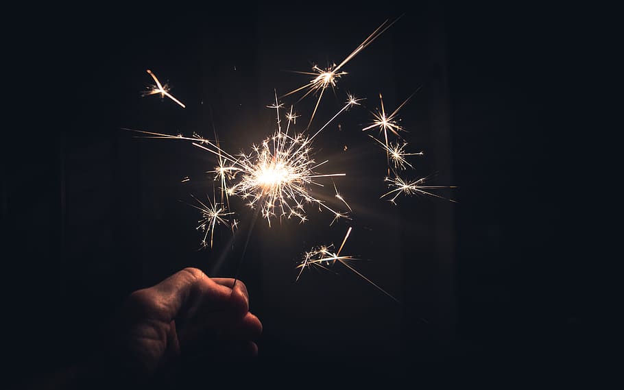 firework, sparkler, wallpaper, hand, new year's eve, party HD wallpaper
