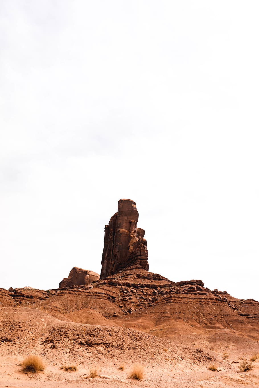 brown rock formation under white sky, nature, outdoors, monument valley HD wallpaper