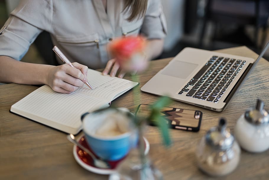 Person Writing On A Notebook Beside Macbook , coffee, composition HD wallpaper