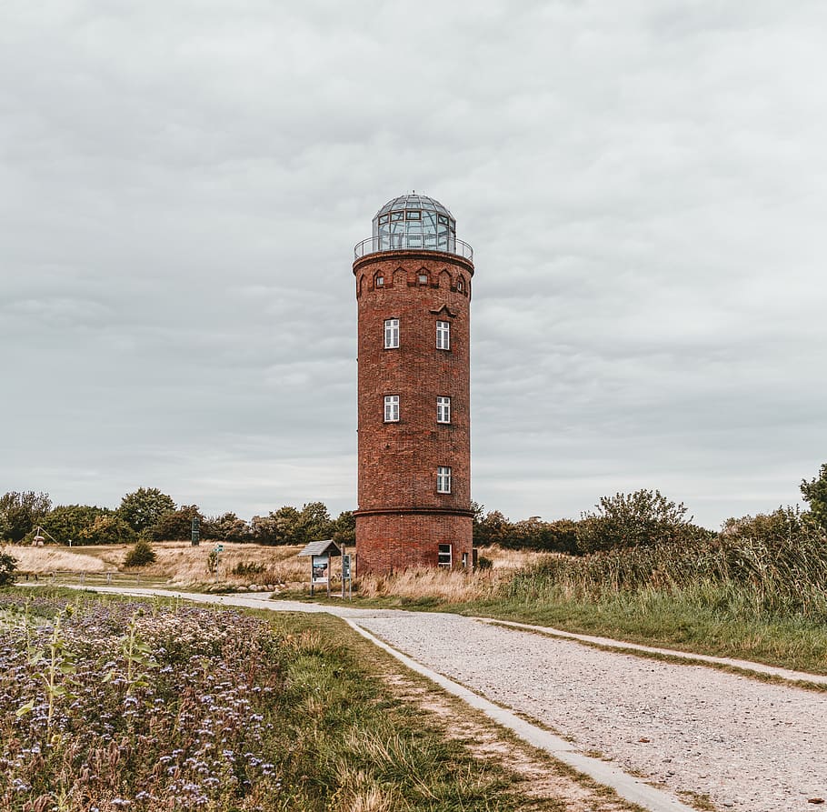Round Brown Lighthouse Near Road Under White Cloudy Skies, architecture HD wallpaper