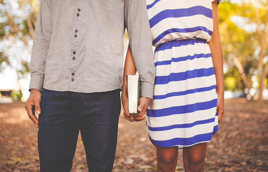 two people holding book, midsection, real people, focus on foreground HD wallpaper