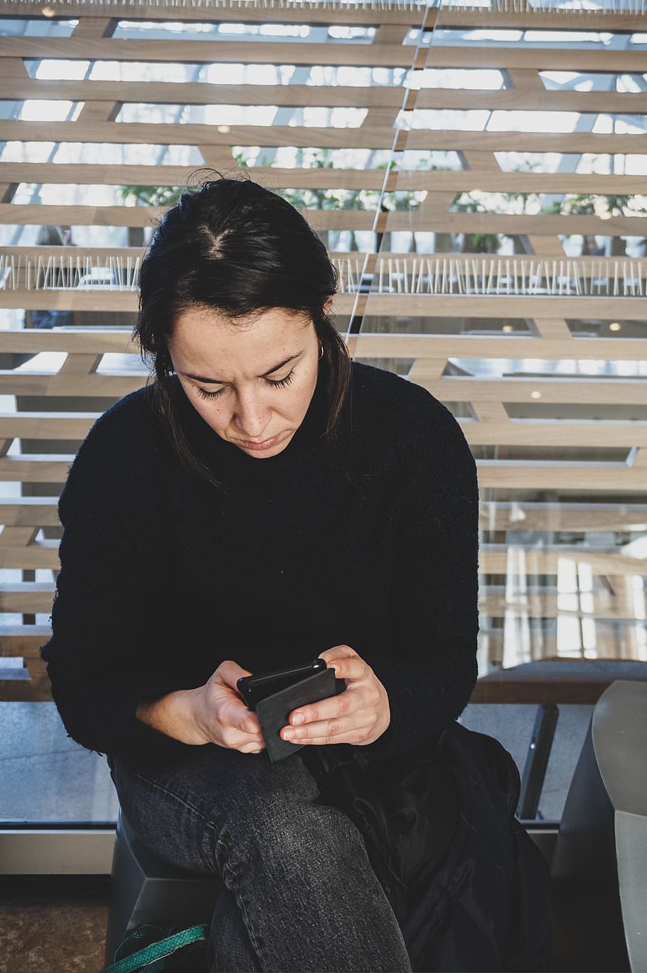 woman sitting on bench while using smartphone, person, human HD wallpaper