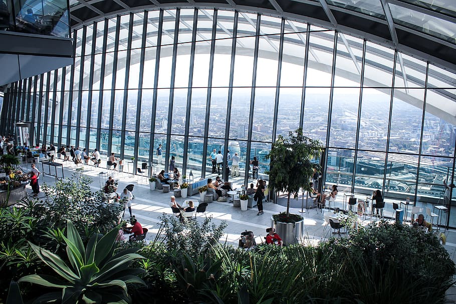 Person Sitting Inside Gray Framed Clear Glass Wall Building, architectural design HD wallpaper