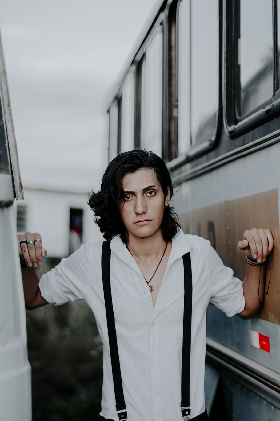 Photo of Man Wearing White Dress Shirt Posing in Between Two  Buses HD wallpaper