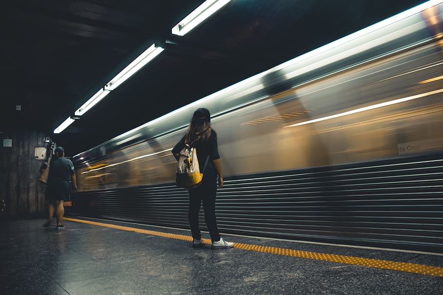 Woman Standing Beside Train Station, action, blur, commute, commuting, HD wallpaper
