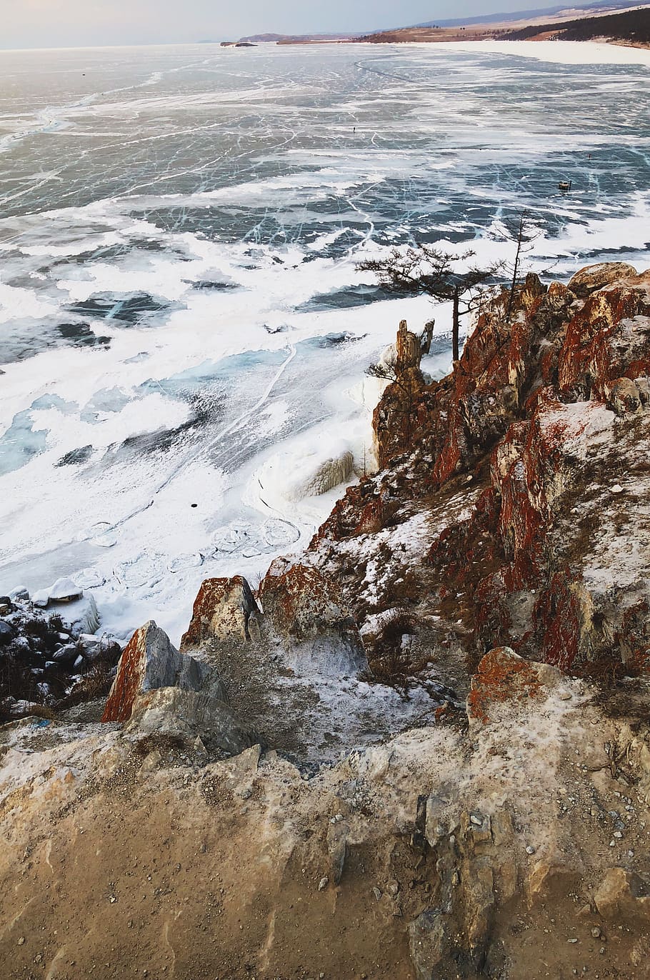 waves crashing on brown rock, outdoors, mountain, nature, ice
