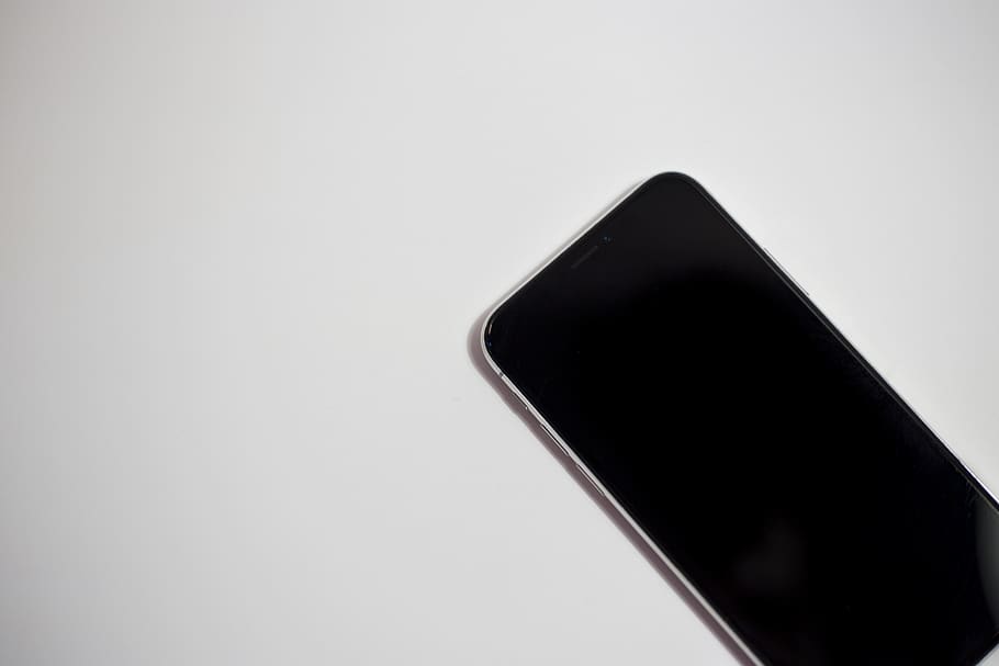 Turned-off Black Smartphone on White Surface, electronics, shape HD wallpaper