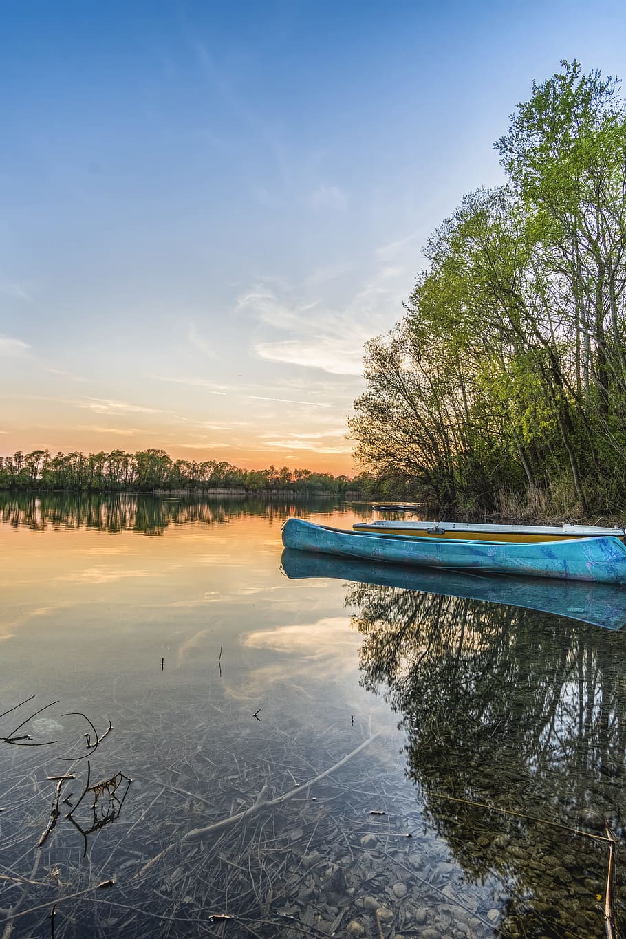 Blue Canoe on Water Beside Trees, boats, clouds, dusk, lake, landscape HD wallpaper