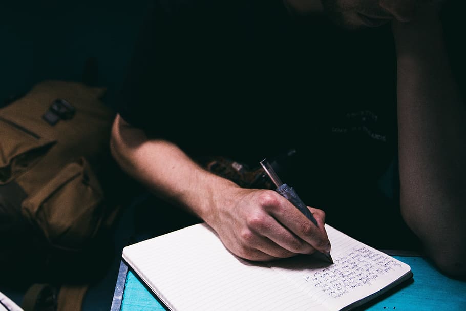 people, man, writing, notebook, pen, study, light, dark, room HD wallpaper