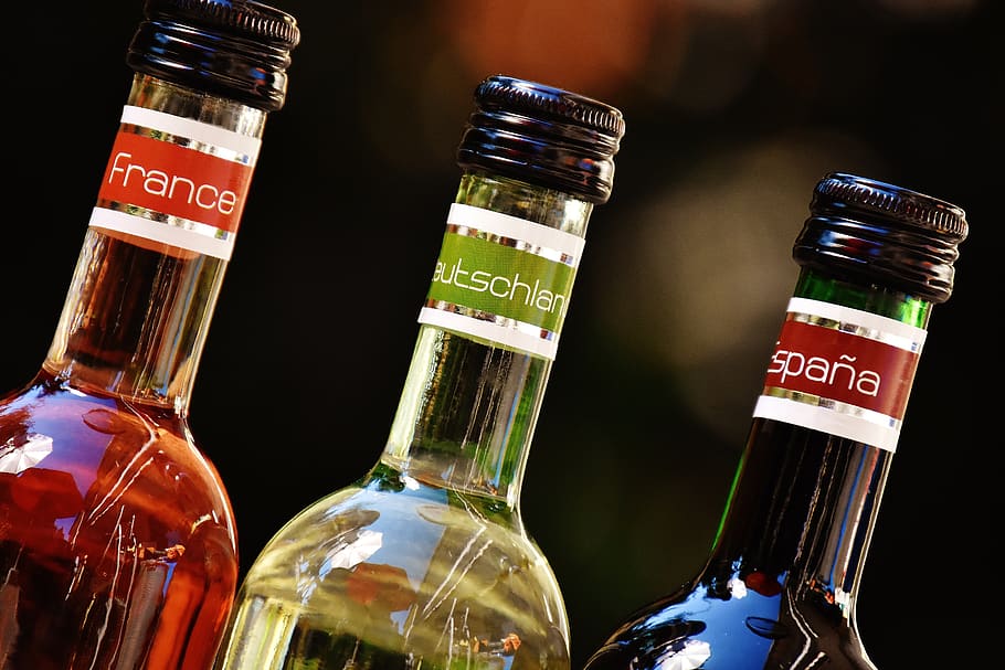 Shallow Focus Photofrapy of France Leutschien Espana Labeled Glass Bottles HD wallpaper