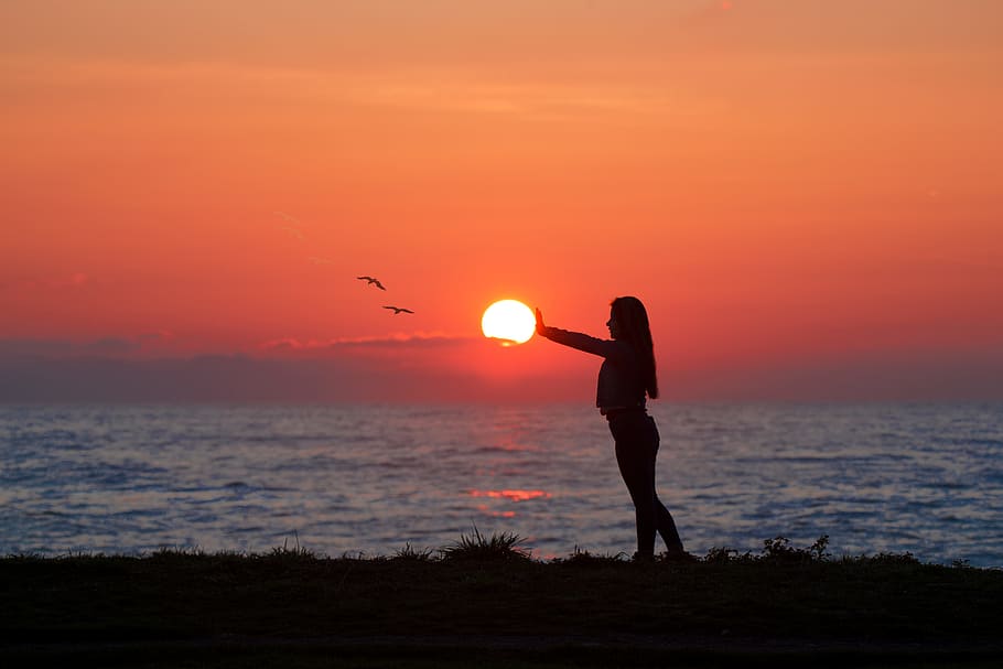 Photo of Woman Standing On Seashore During Dawn, backlit, beach HD wallpaper