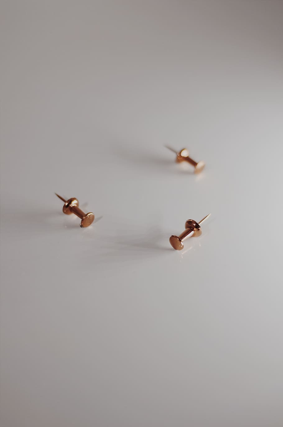 Three Gold Tacks, color, pins, push pins, sharp, table, thumb tacks HD wallpaper