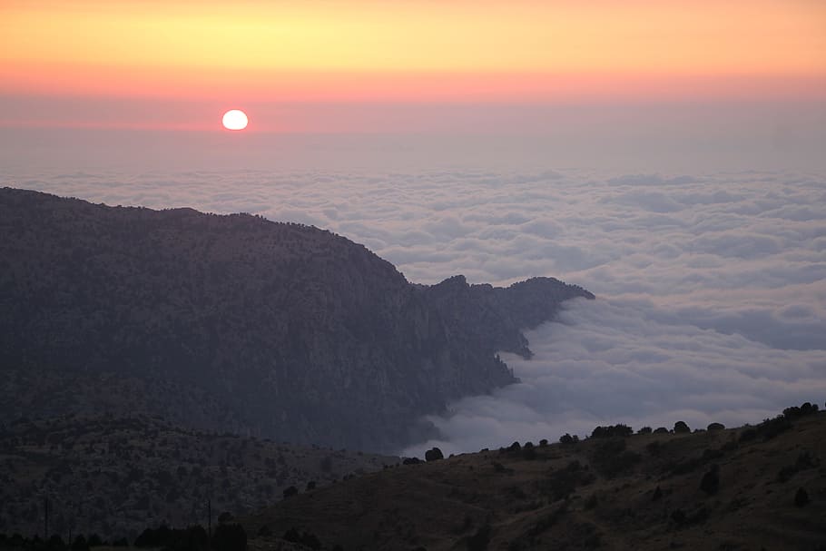 aerial photography of mountains and white clouds during golden hour HD wallpaper