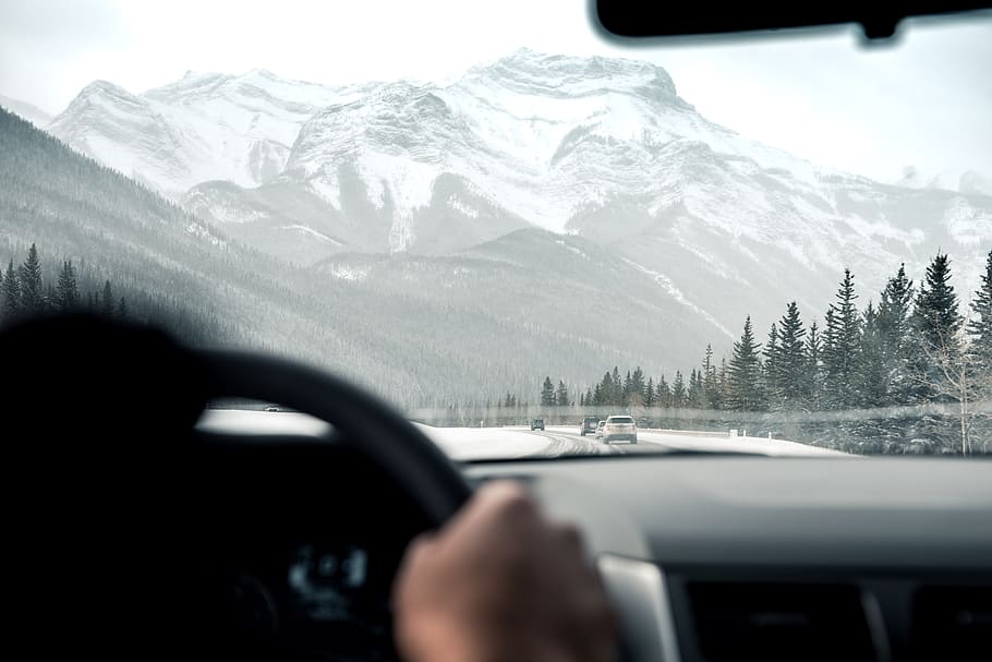 person driving facing through grey mountain, road, peak, summit HD wallpaper