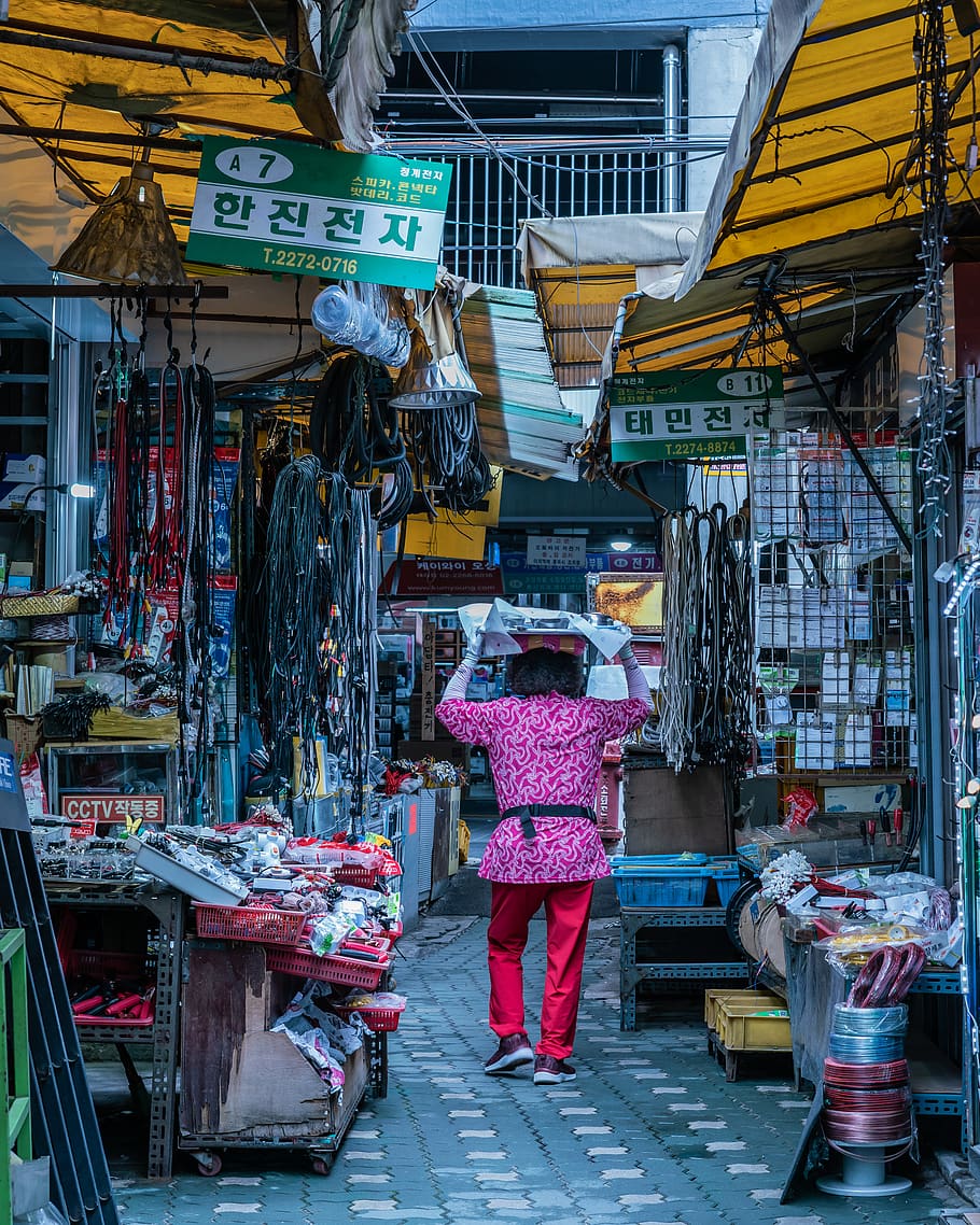 Woman Walking on Pathway Between Stores, bazaar, Booth, carry