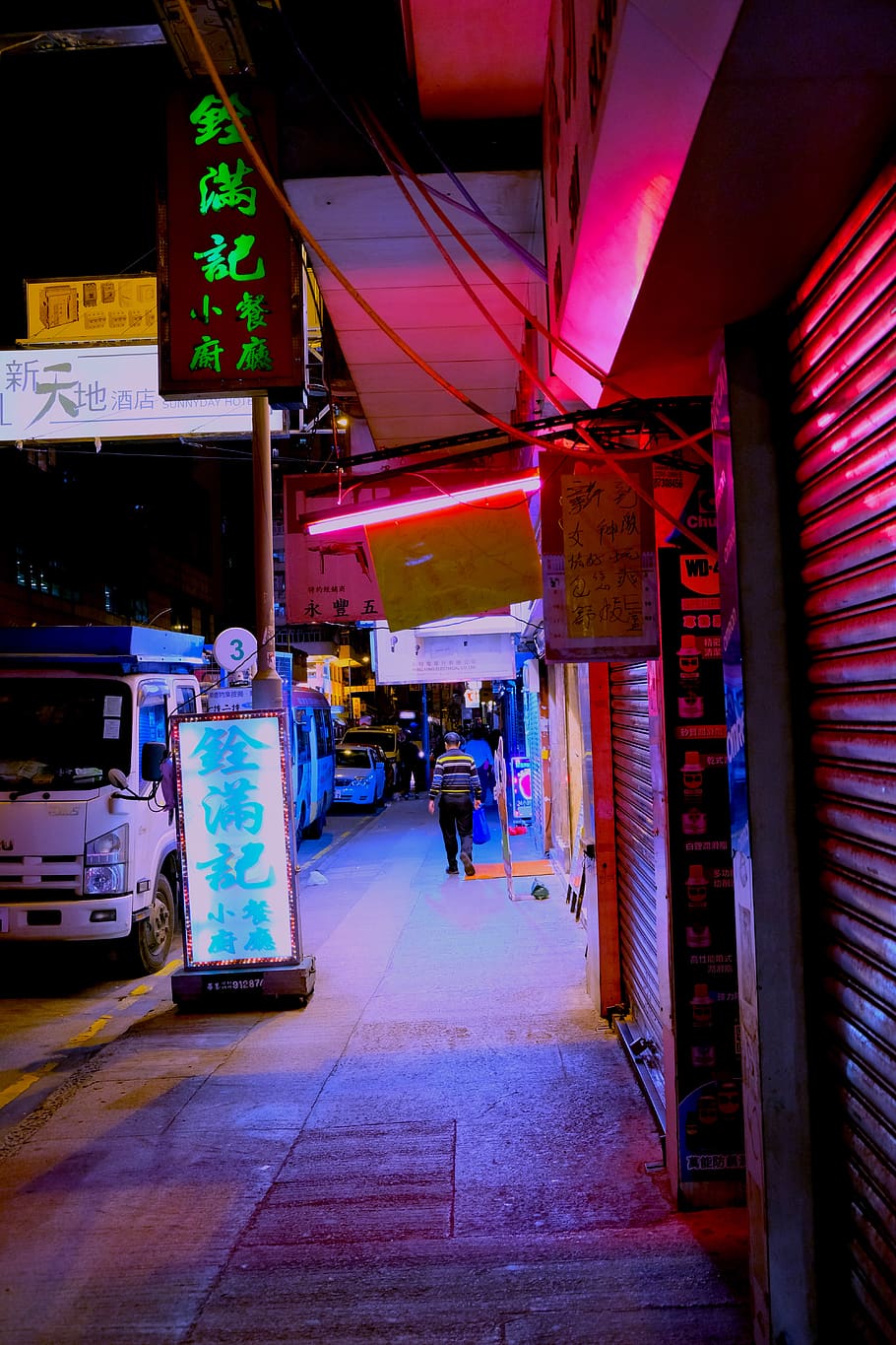 person-walking-on-sidewalk-at-night.jpg