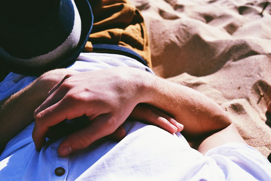 Person Lying on Sand, arm, close -up, daylight, hands, hat, man HD wallpaper