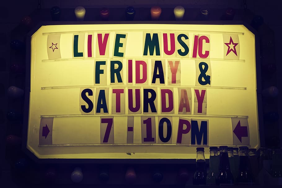 Live Music Friday & Saturday 7-10 Pm Signage, alphabet, bottles