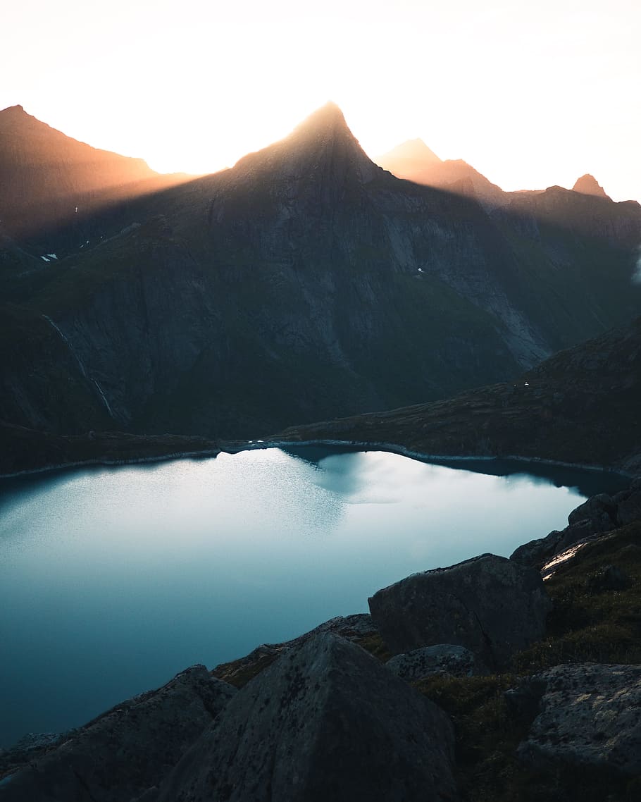 gray mountain near lake, peak, sunshine, sunlight, water, dark, HD wallpaper