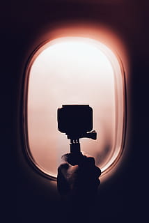 person holding action camera, window, maldives, porthole, finger HD wallpaper