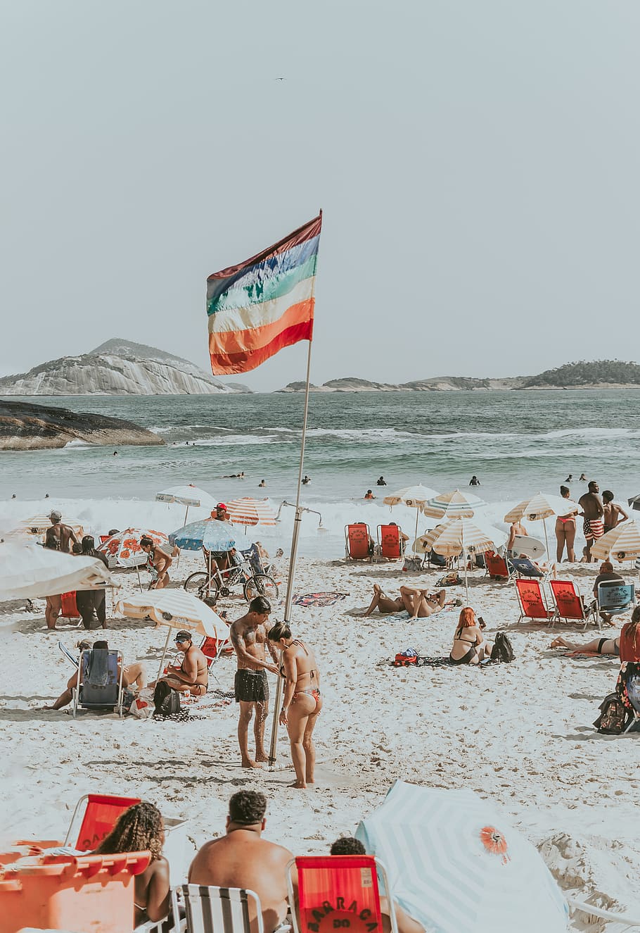 people sitting on seashore, water, flag, sky, beach, group of people HD wallpaper