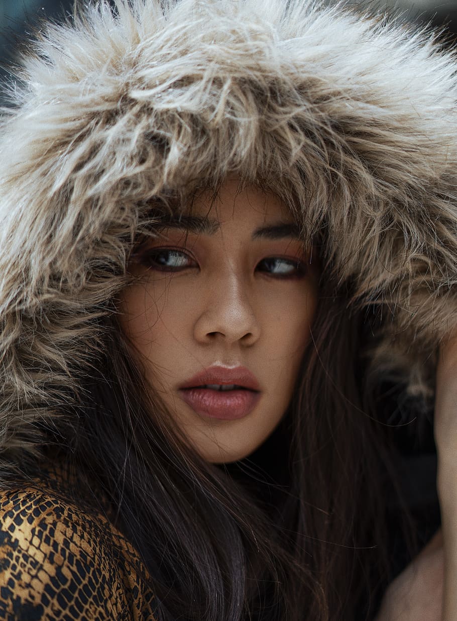 woman in gray fur hoodie, portrait, headshot, young adult, one person