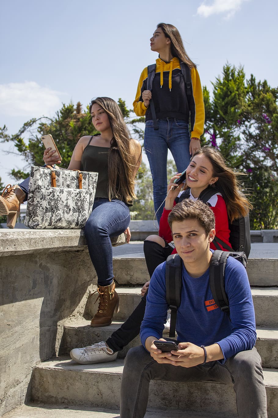 Group of People Sitting on Stairs, casual, cellphones, children