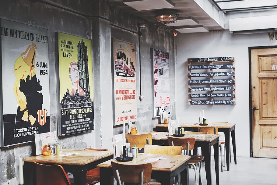 assorted poster on wall, table, chair, print, empty, restaurant HD wallpaper