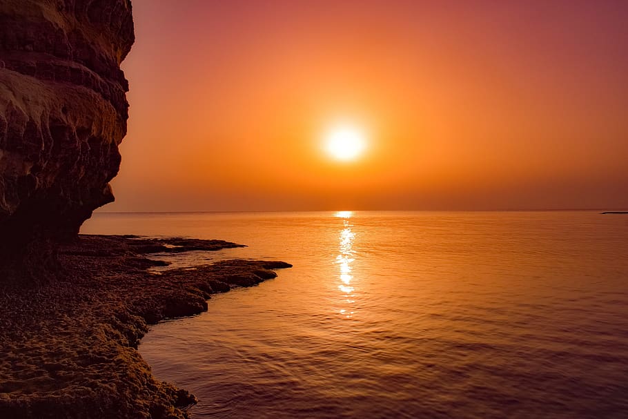sunset, sea, dusk, evening, rock, cliff, scenery, colorful HD wallpaper