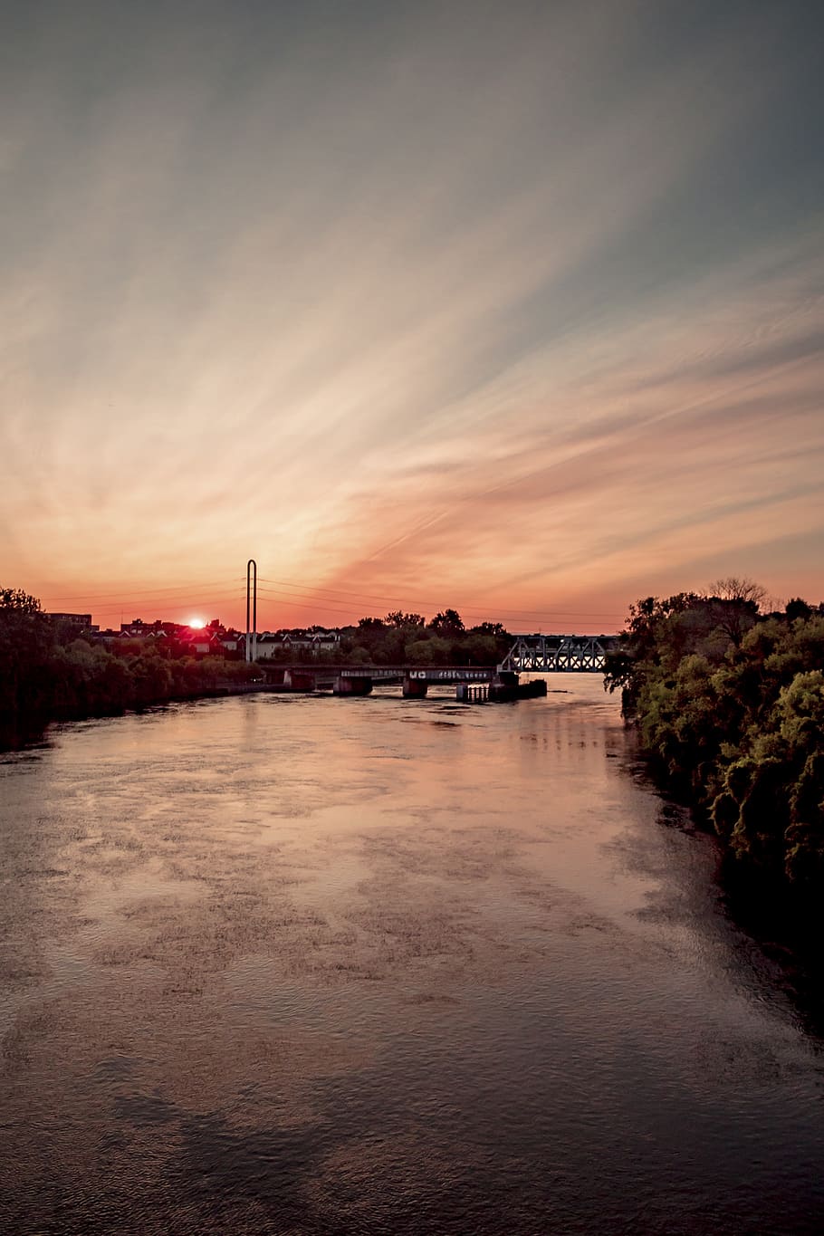 river, water, trees, sun, sunset, sky, colorful, bridge, rays HD wallpaper