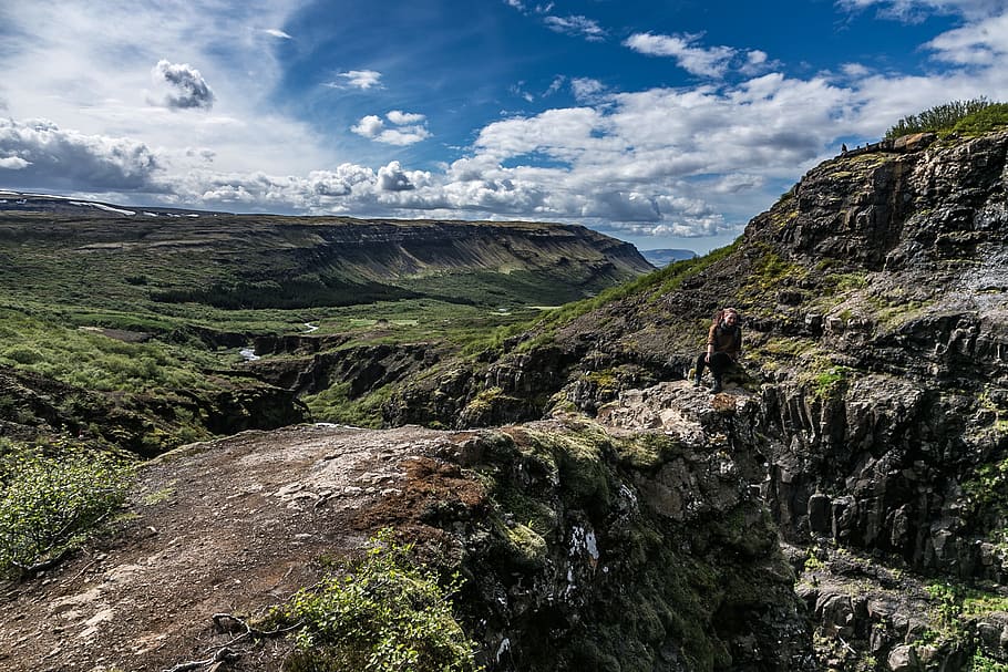 Person Near Mountain Cliff, cliffs, clouds, daylight, environment HD wallpaper