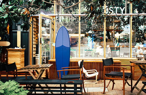 Blue Surfboard Leaning on Desk, bistro, café, cafeteria, chairs HD wallpaper