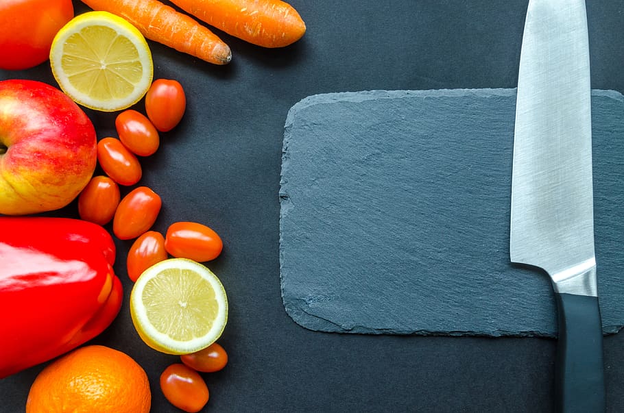 Brightly colored citrus knife on a background