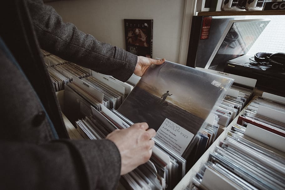 person holding vinyl album, lp, music store, record, hand, lifestyle