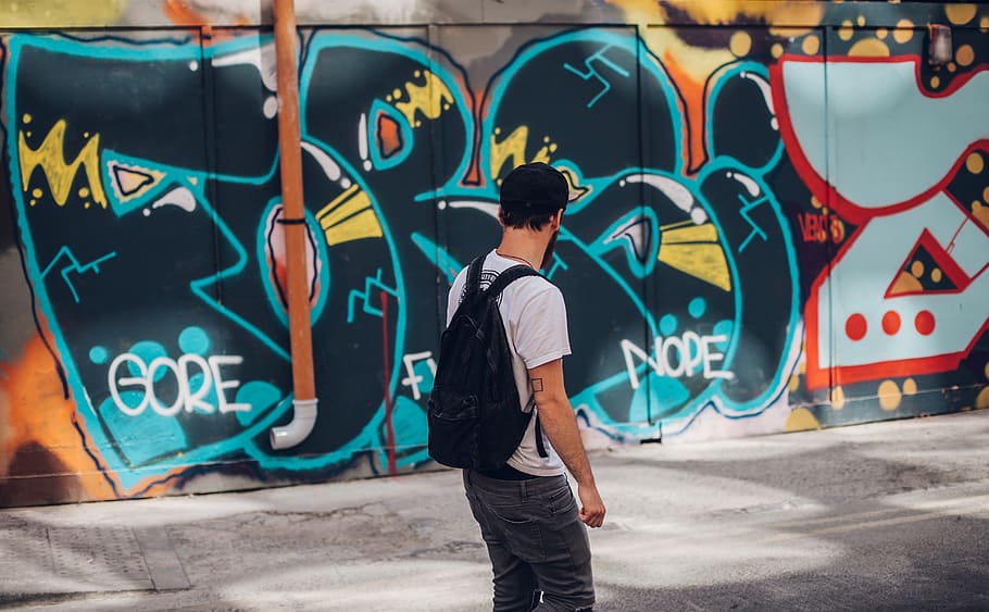 man wearing black backpack, graffiti, one person, art and craft HD wallpaper