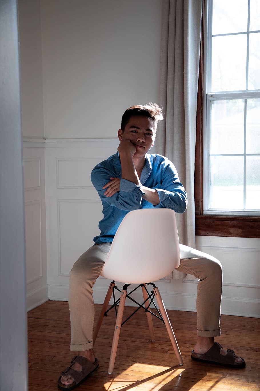 man sitting on Eiffel chair, furniture, wood, home decor, person HD wallpaper