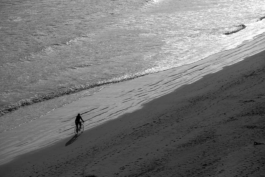 Man Riding Bike on Seashore, beach, bicycle, biker, biking, black-and-white HD wallpaper