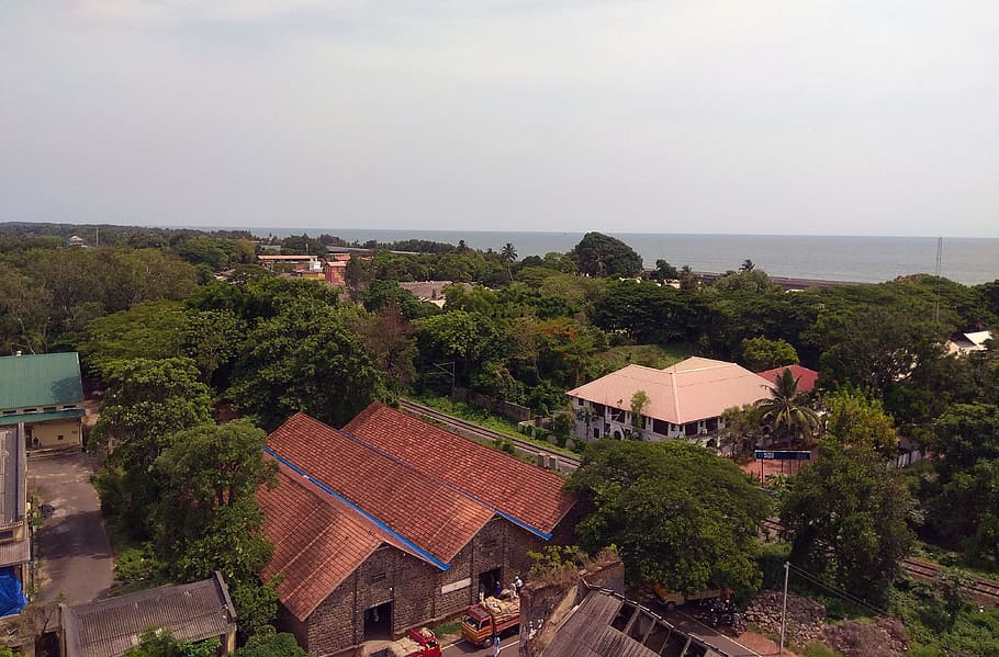 This is landscape photo take from the top of Alleppey Lighthouse tower. It is one of the main tourist attraction of alleppey city which helps to enjoy the view from the top. You can see the sea, trees, buildings etc. It is one of the green city in Kerala. HD wallpaper