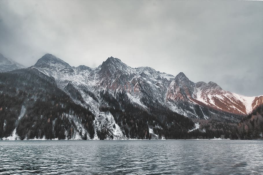 mountain covered with snow under gray clouds, alps, outdoors HD wallpaper