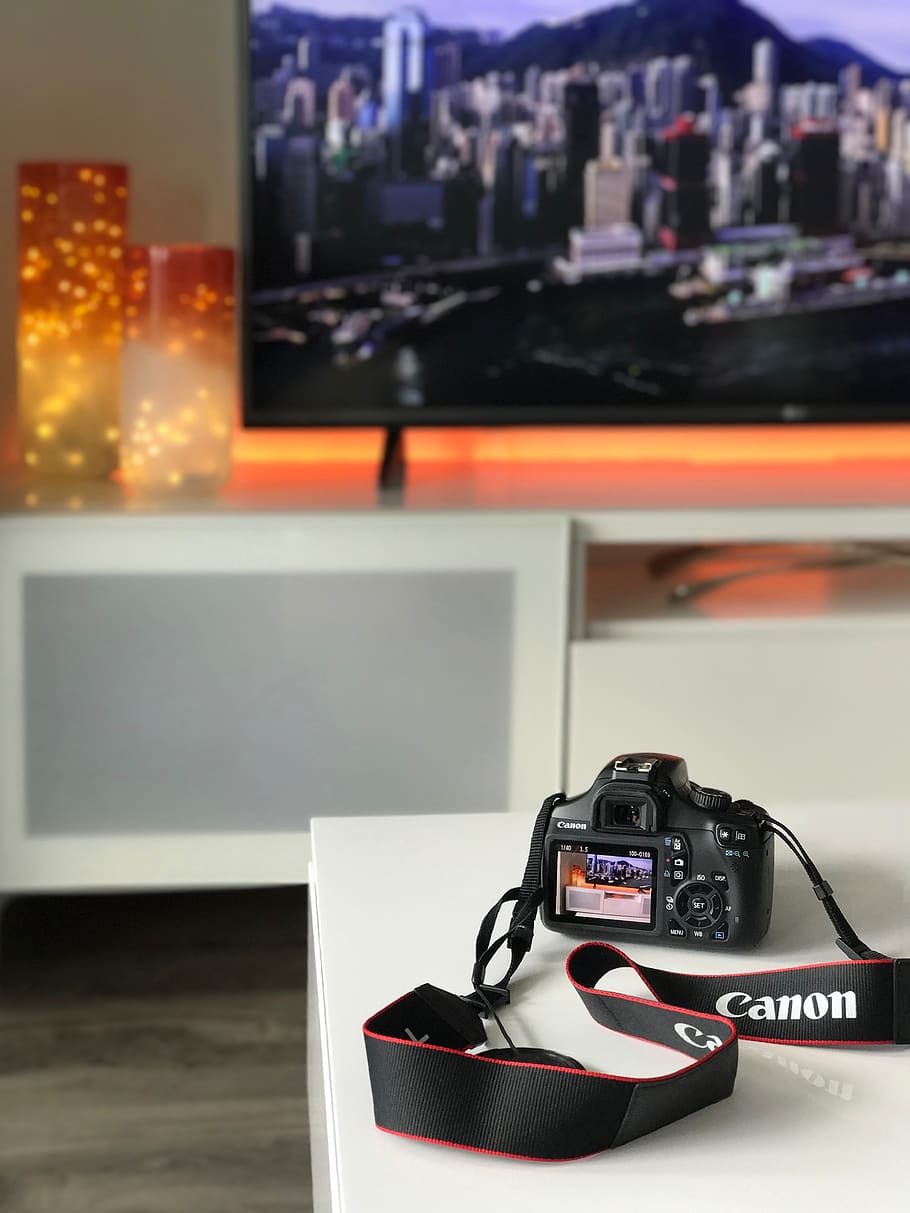 Black Canon Camera on White Wooden Table, desk, electronics, equipment HD wallpaper