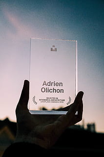 Adrien Olichon trophy, human, person, finger, text, phone, electronics HD wallpaper