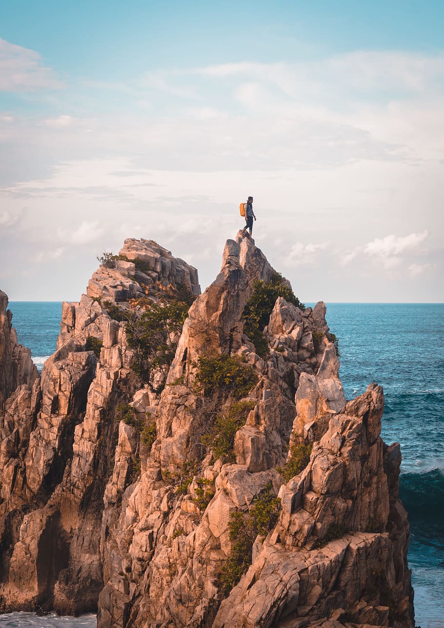 man standing on cliff, coast, rock, climb, hike, outdoors, water HD wallpaper
