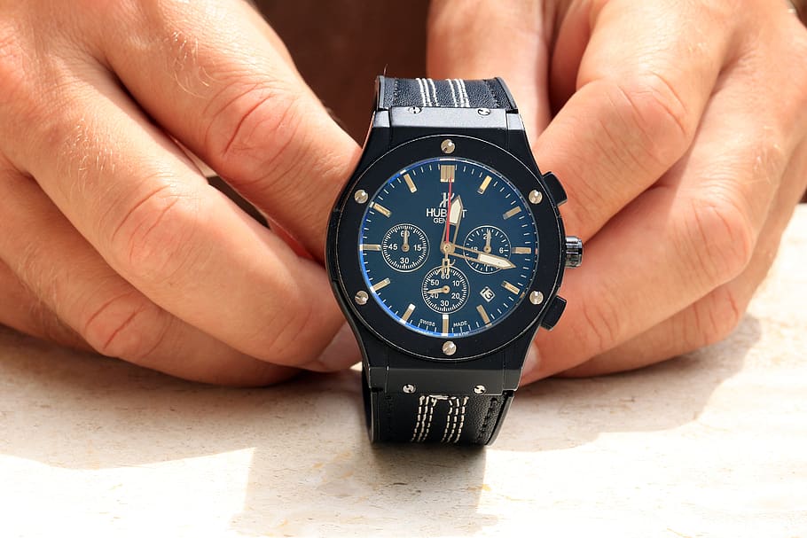 Person Holding Black Chronograph Watch, dial, electronics, hands HD wallpaper